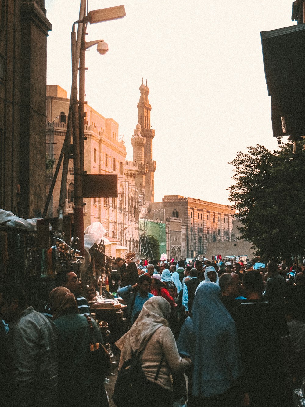 people walking on street near brown concrete building during daytime