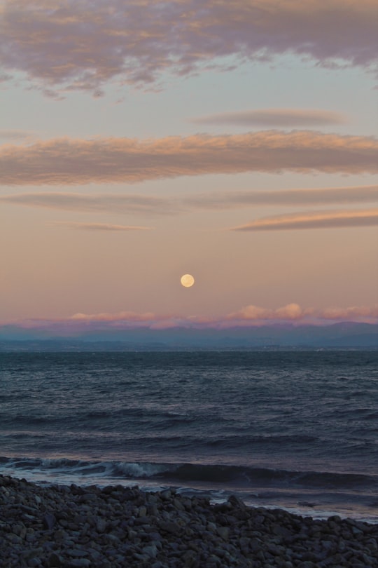 body of water during sunset in Glenduan New Zealand