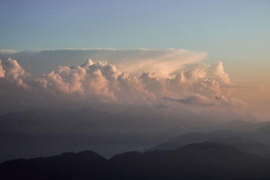 white clouds over silhouette of mountains during daytime in Luzern Switzerland