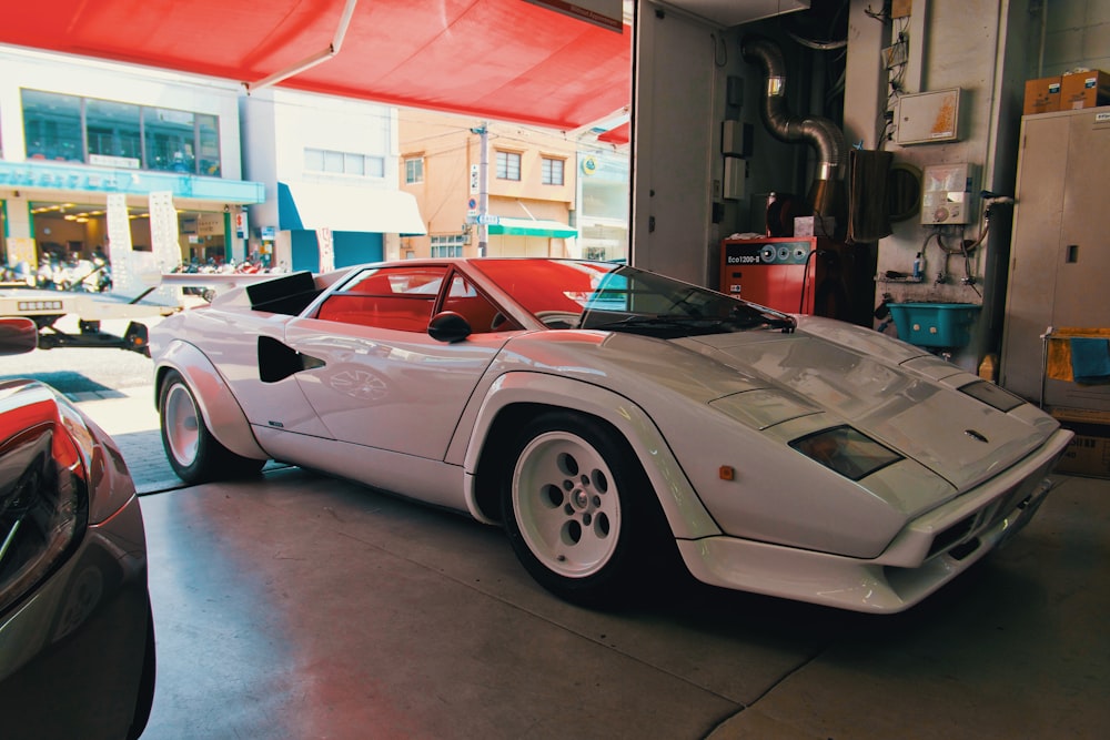 white porsche 911 parked in garage