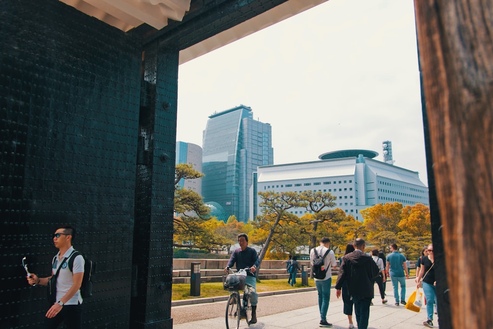 people walking on sidewalk during daytime