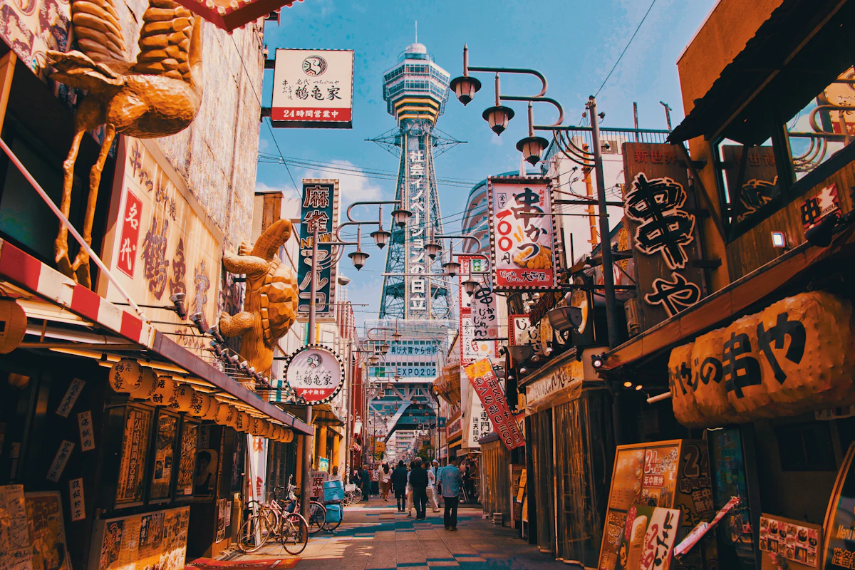 Restaurants and signs leading towards Tsutenkaku in Osaka's Shinsekai district