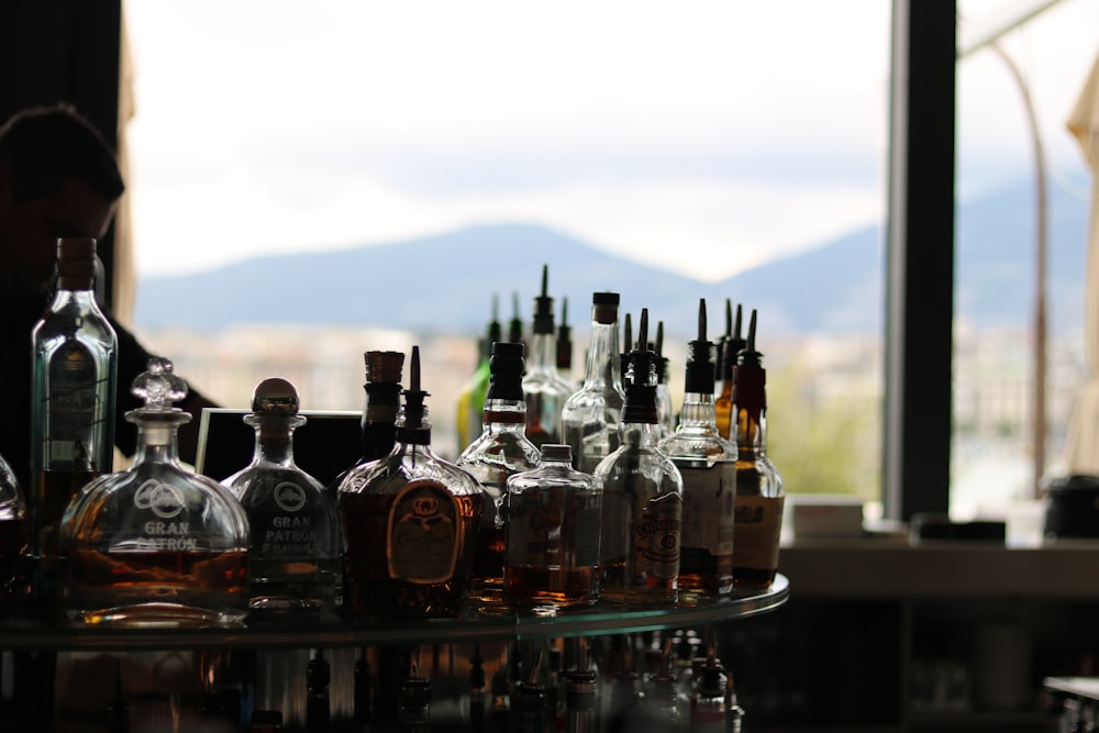 clear glass bottles on table