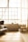 A beautifully staged living room with natural light streaming through large windows.