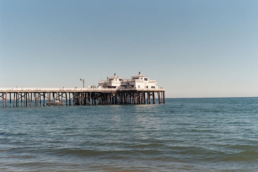 white and brown wooden dock on sea during daytime