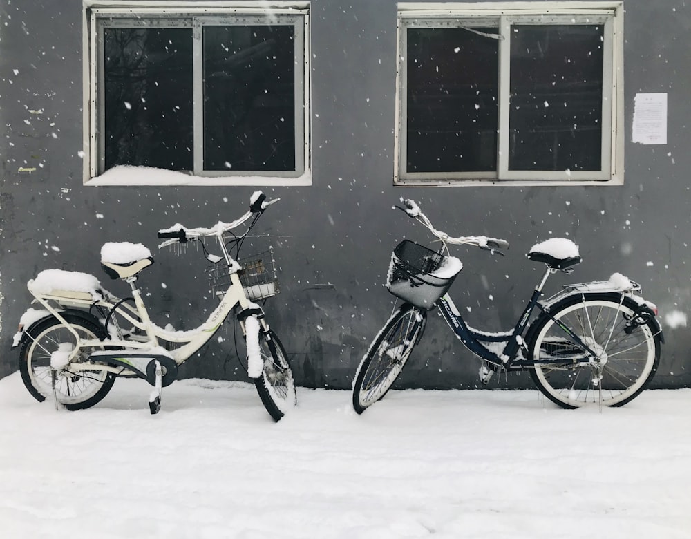 black and brown city bike on snow covered ground