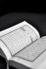 white book page on black textile