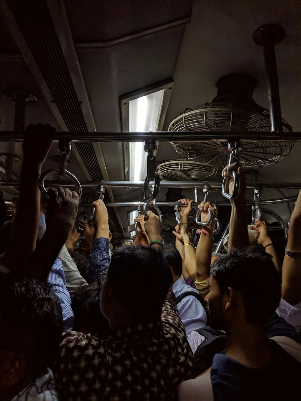 people in a room with a man in a train