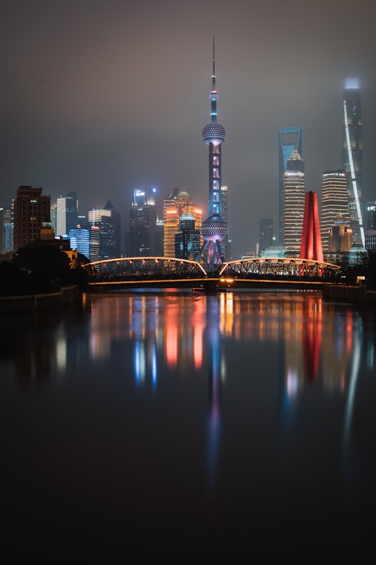 city skyline during night time in Waibaidu Bridge China