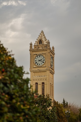 big ben under white clouds
