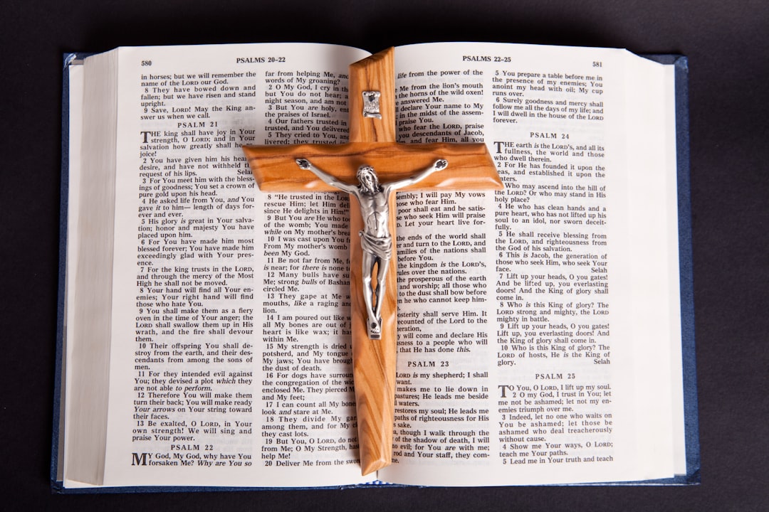 brown wooden cross on book page