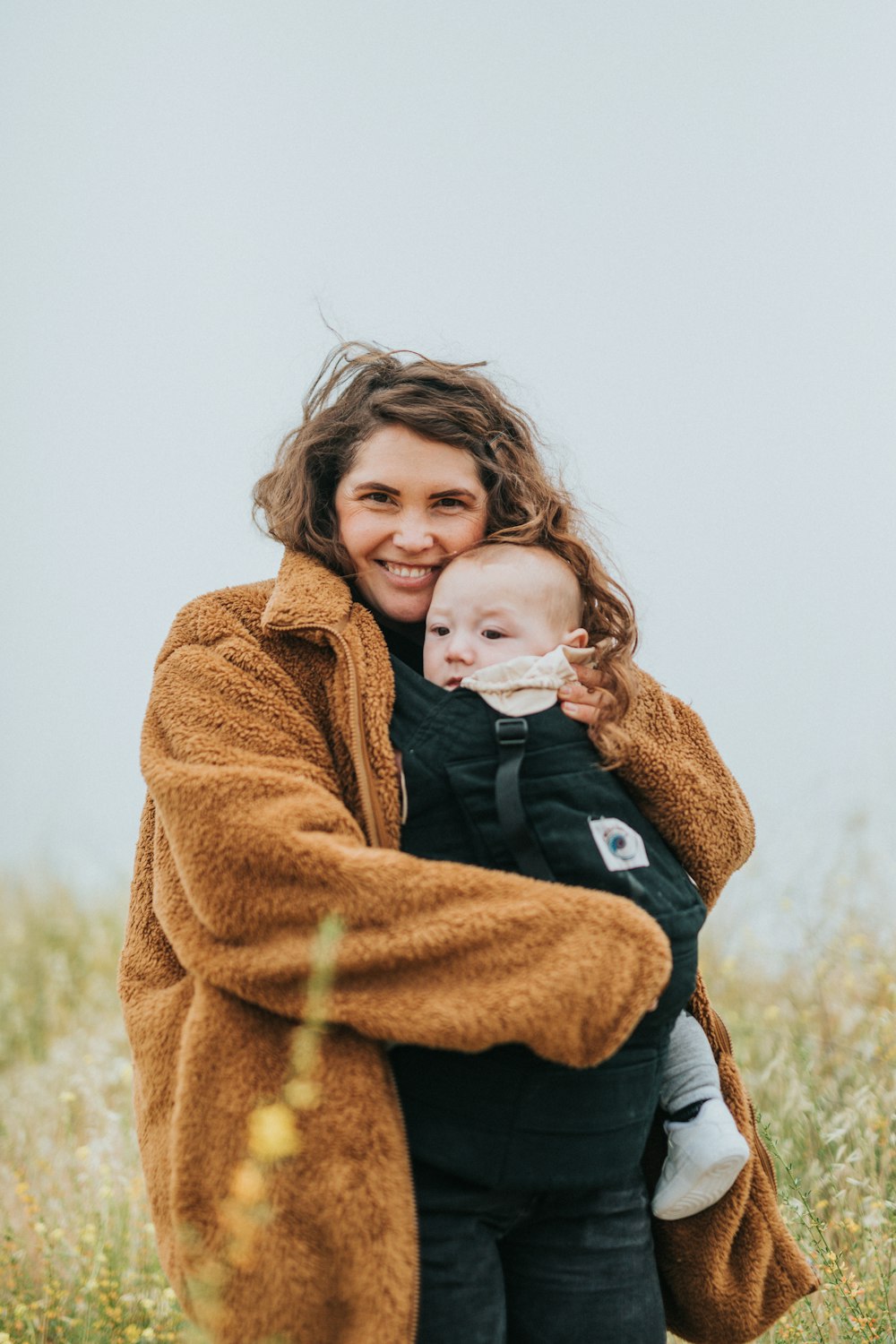 girl in brown coat standing