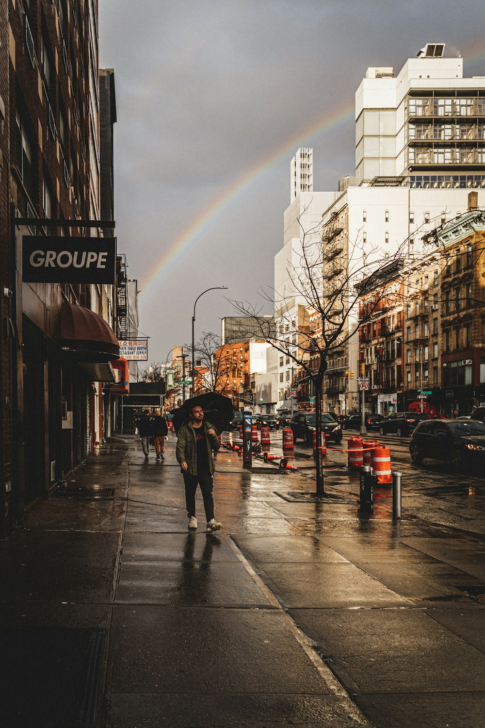 people walking on sidewalk during daytime