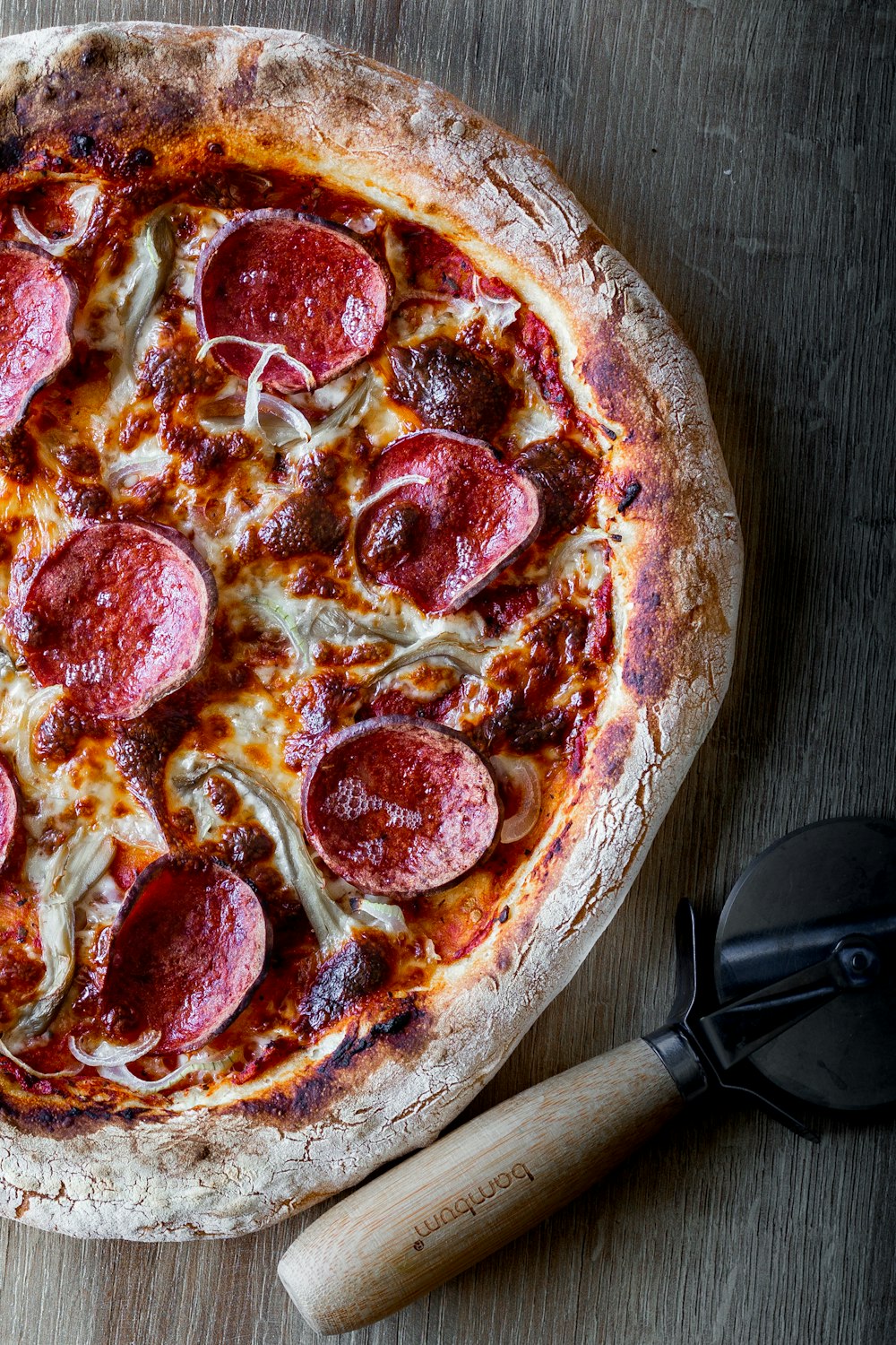 pizza on brown wooden table