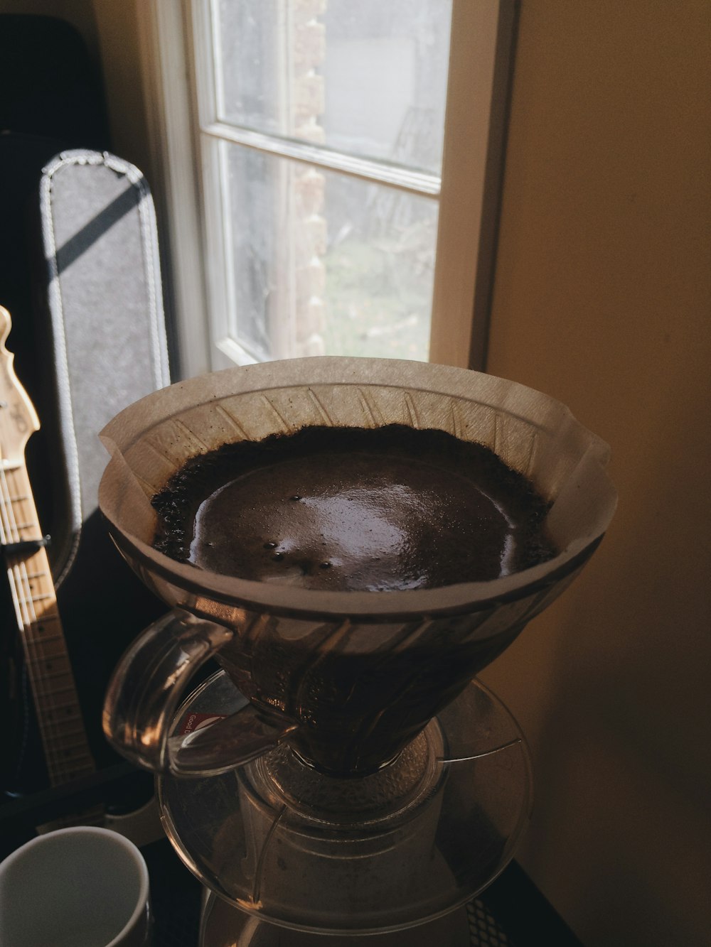 brown ceramic bowl on brown wooden table