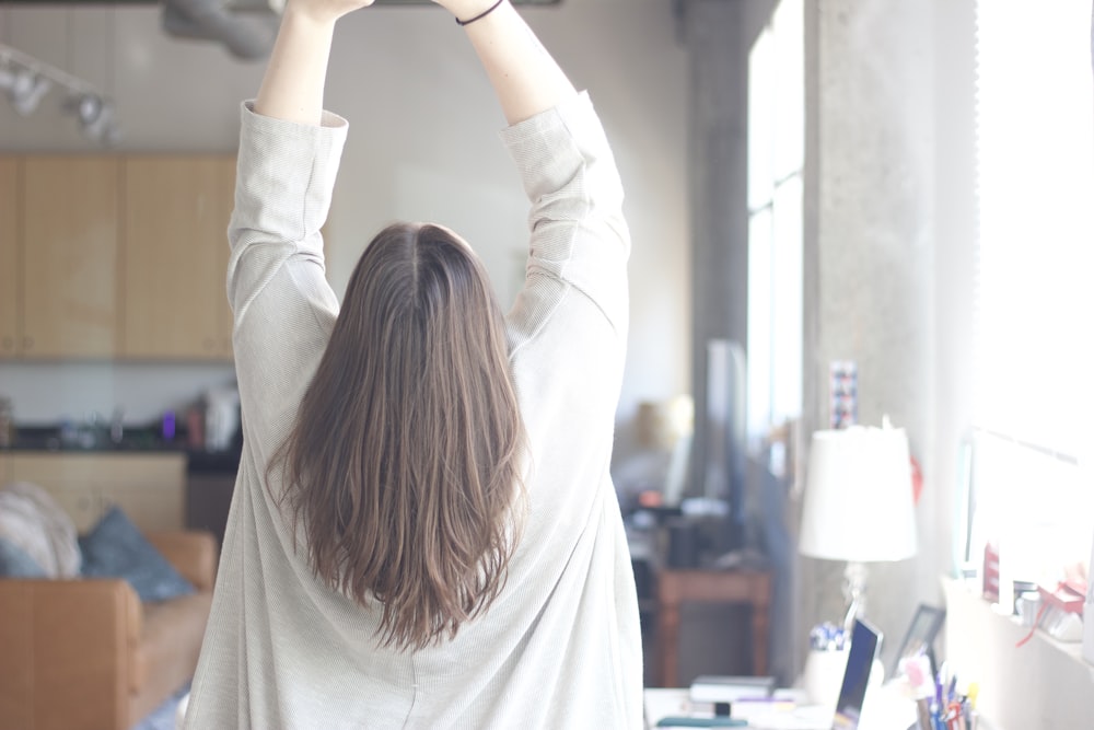 woman in white long sleeve shirt