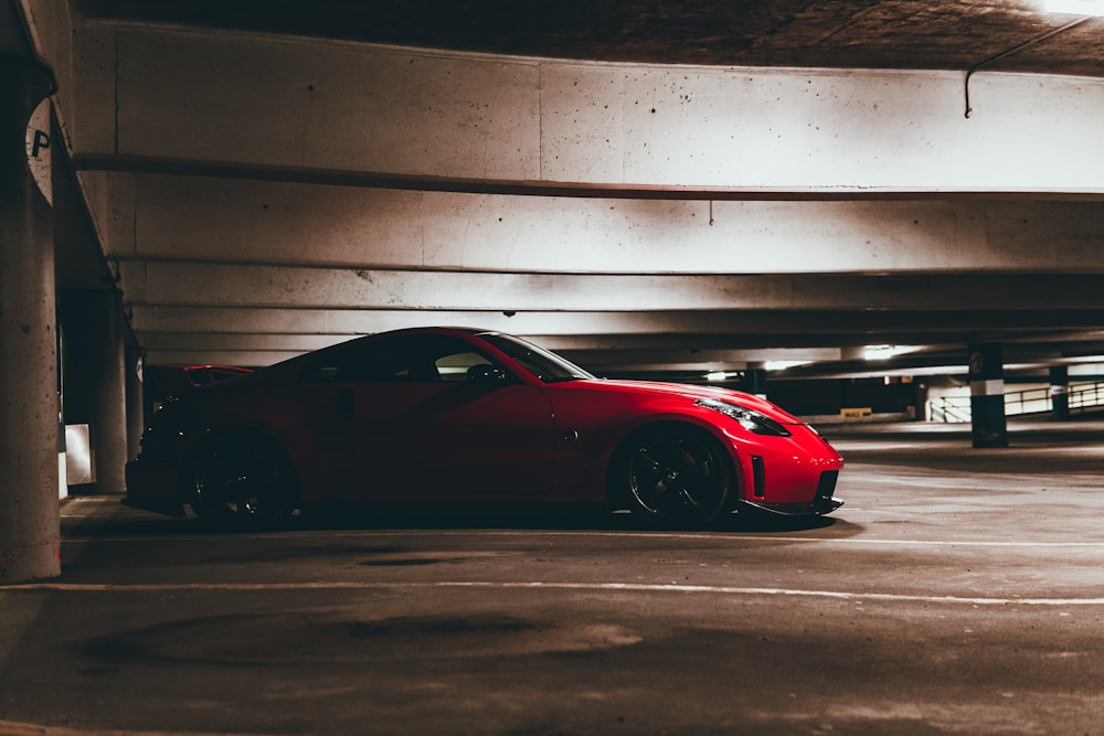 red ferrari 458 italia parked on parking lot