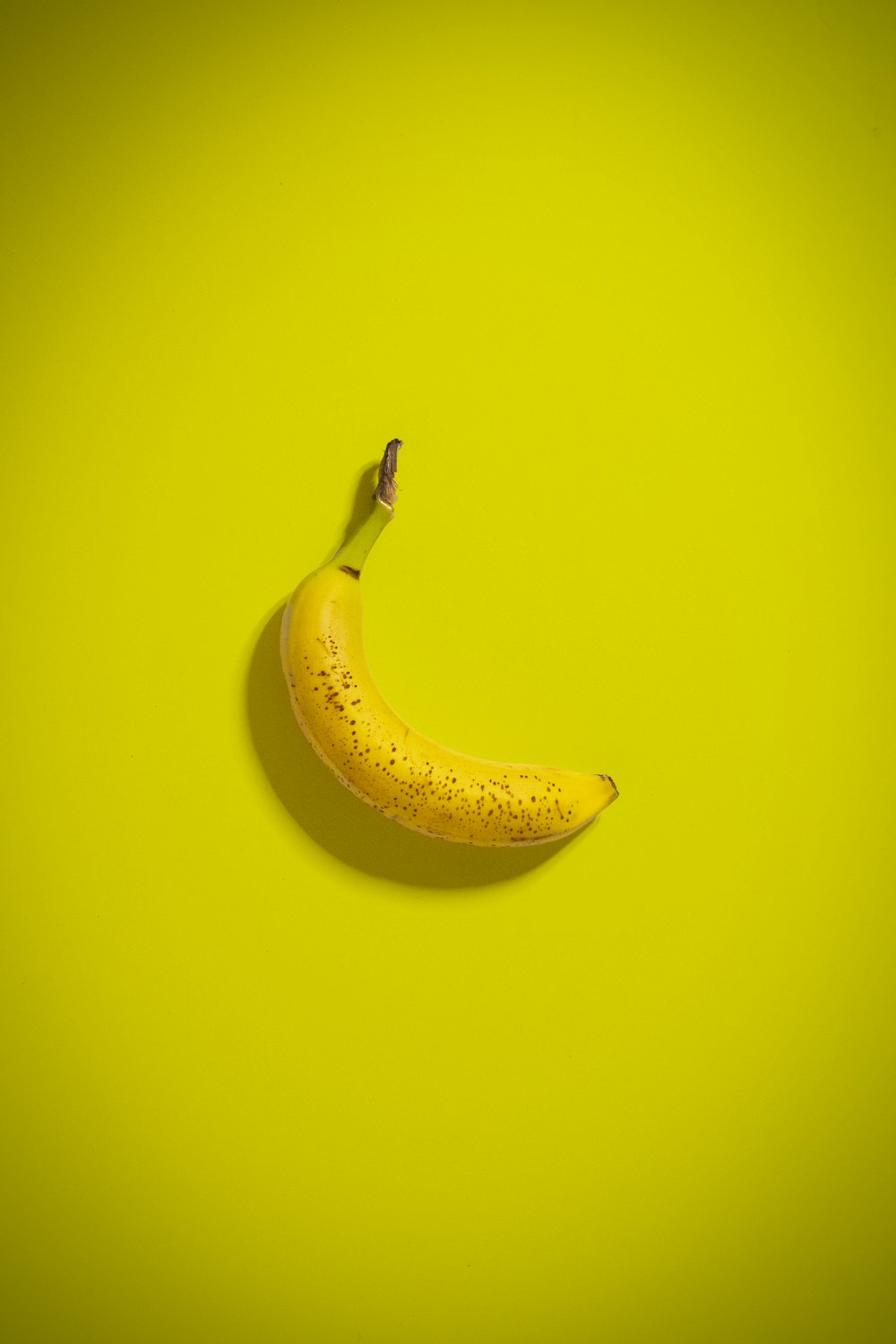 yellow banana fruit on yellow surface