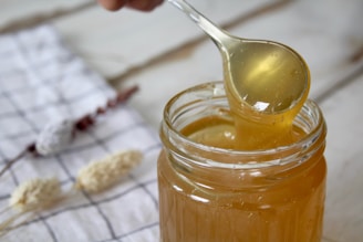 clear glass jar with yellow liquid