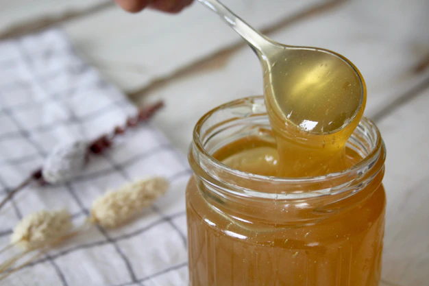 clear glass jar with yellow liquid