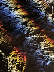 Finished rockwall showcasing vibrant colors and textured paint strokes under natural light.