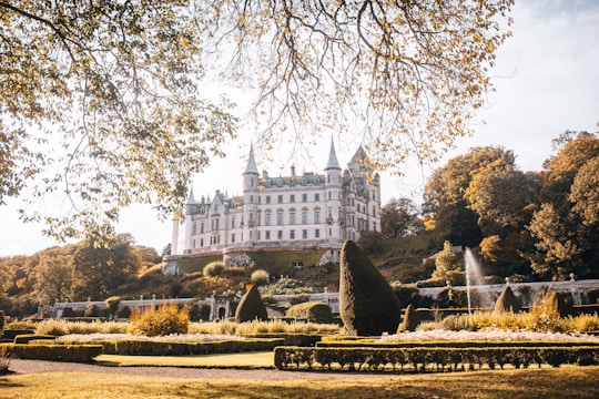 water fountain in front of white concrete building