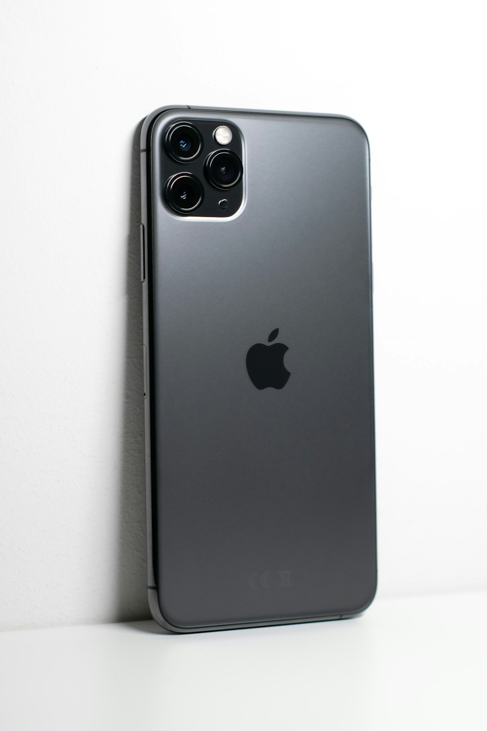 black iphone 7 plus on white surface