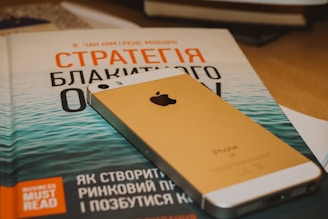 gold iphone 6 on brown wooden table