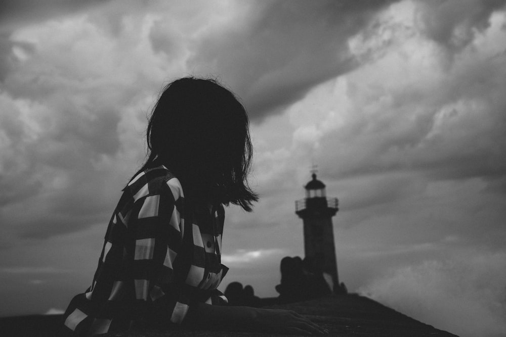 grayscale photo of woman in stripe shirt