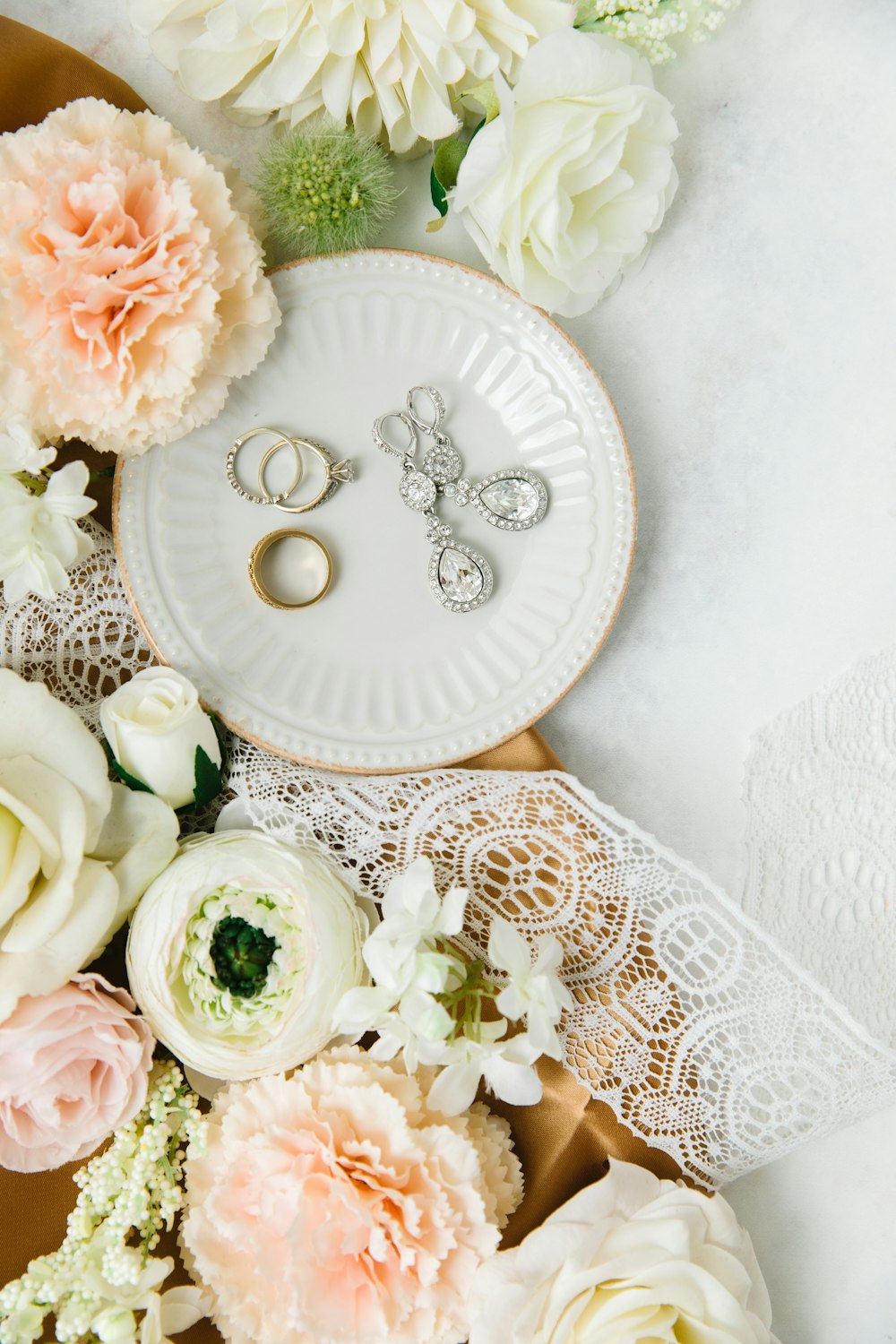 white and pink roses on white ceramic round plate