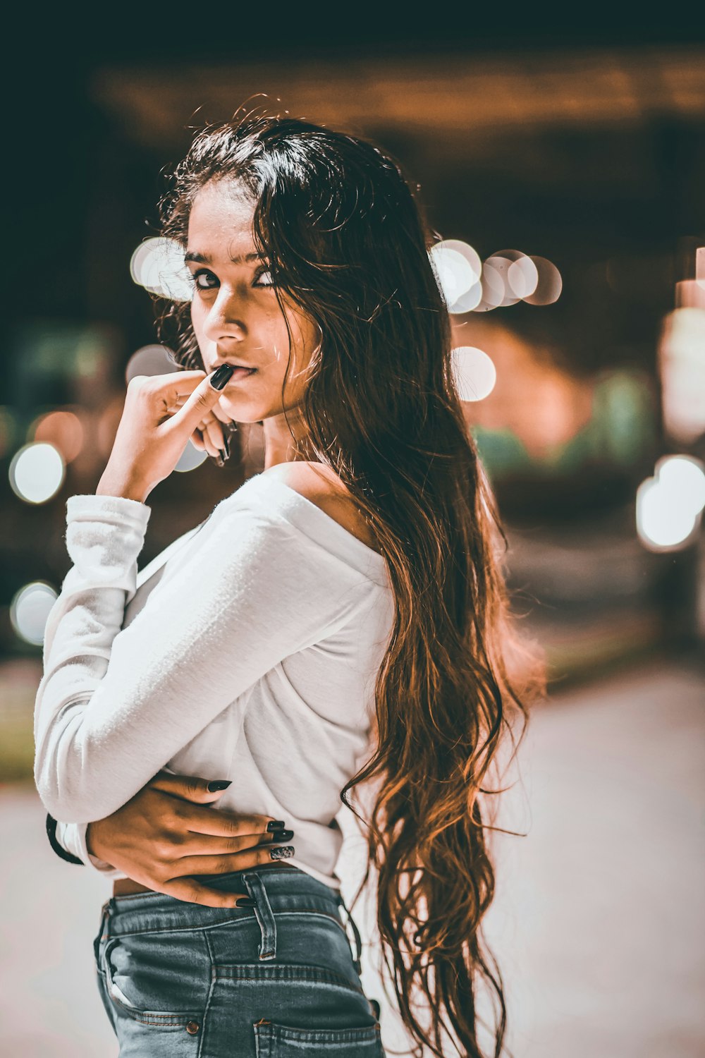 woman in white long sleeve shirt smoking