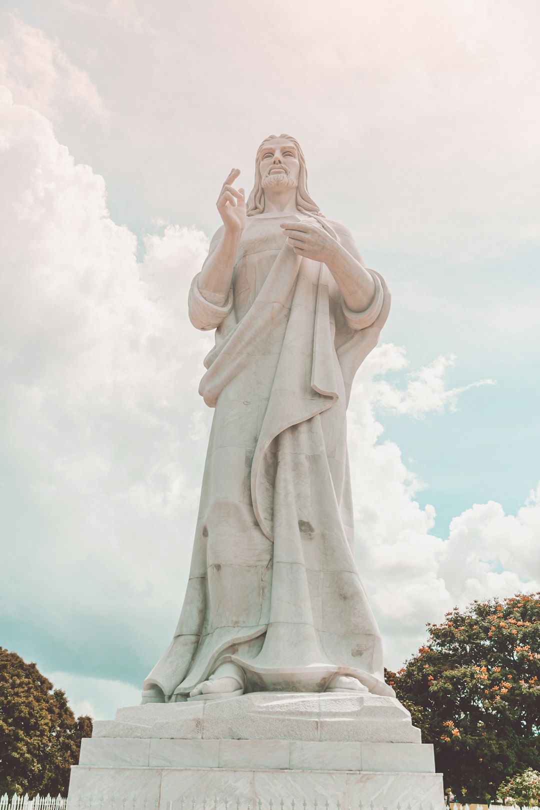 white concrete statue of a woman