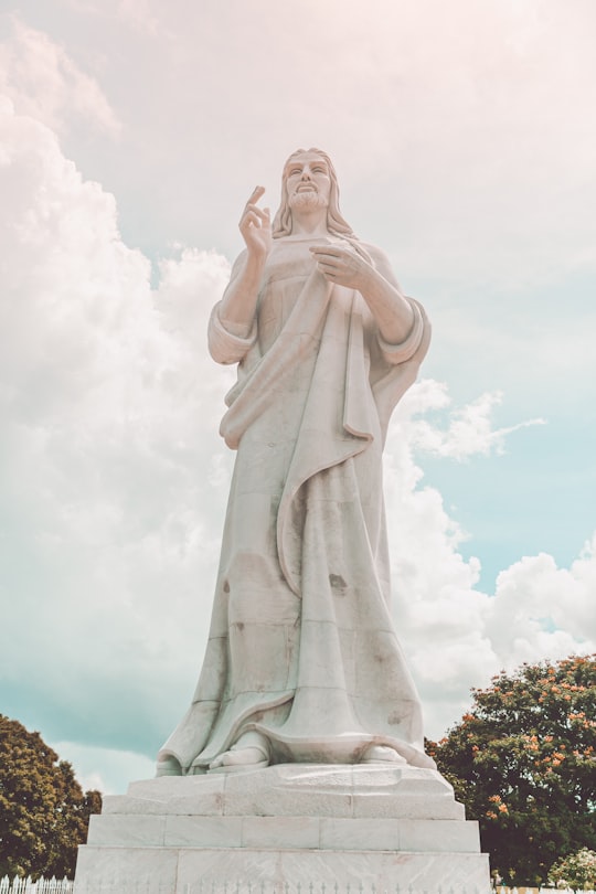 white concrete statue of a woman in Christ of Havana Cuba