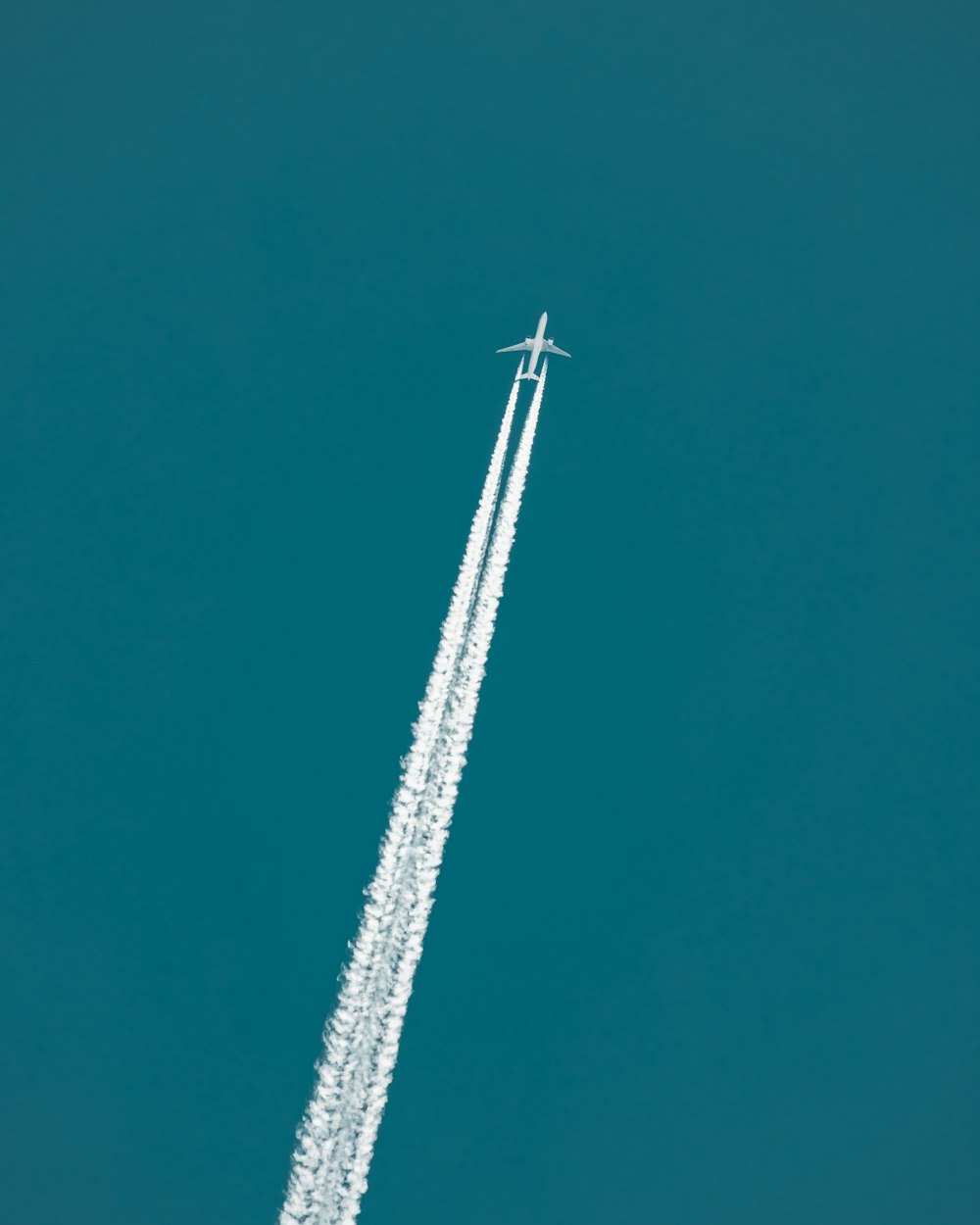 white and black jet plane in the sky