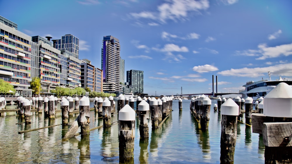 white and brown concrete building near body of water during daytime