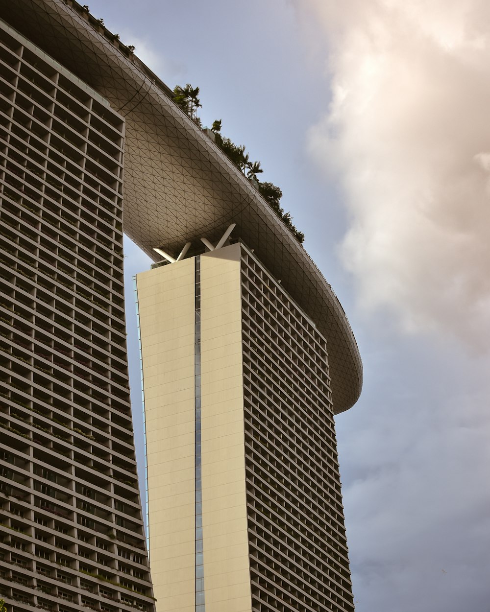 gray concrete building under white clouds during daytime