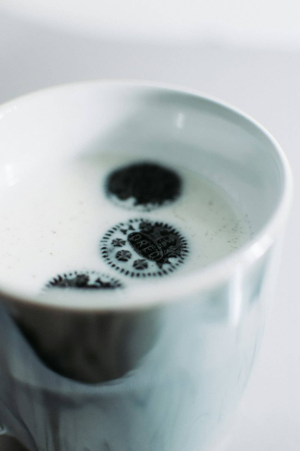 white ceramic cup with black liquid