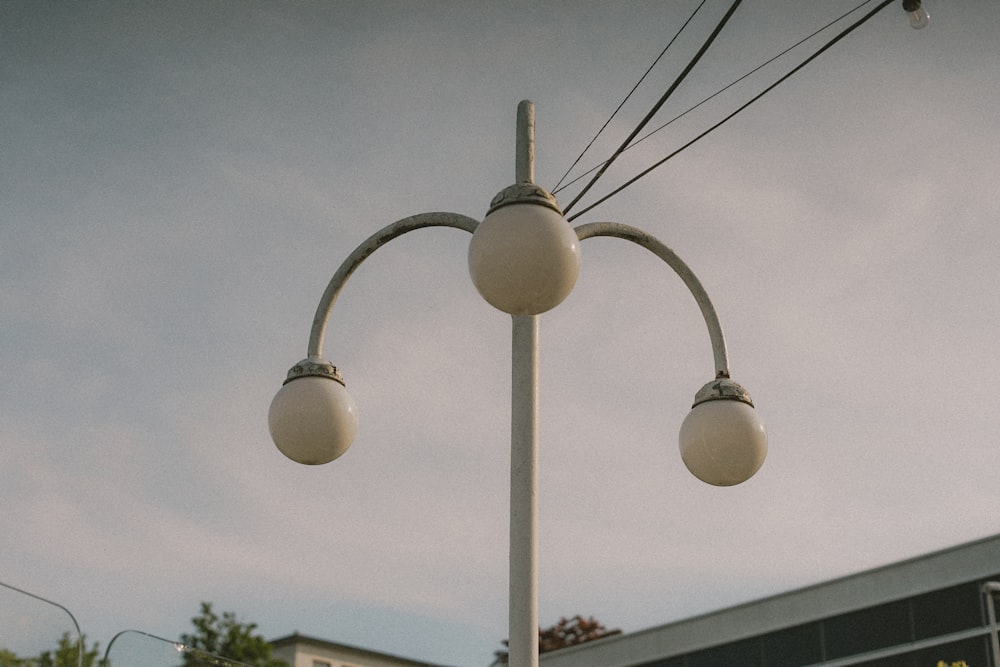 white light bulb turned on during daytime