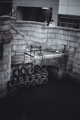 Group of students testing a bridge model for strength.