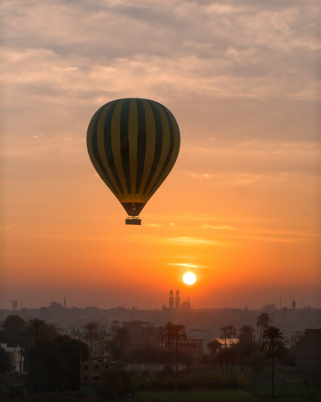 green hot air balloon during sunset