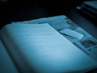 white book page on black table