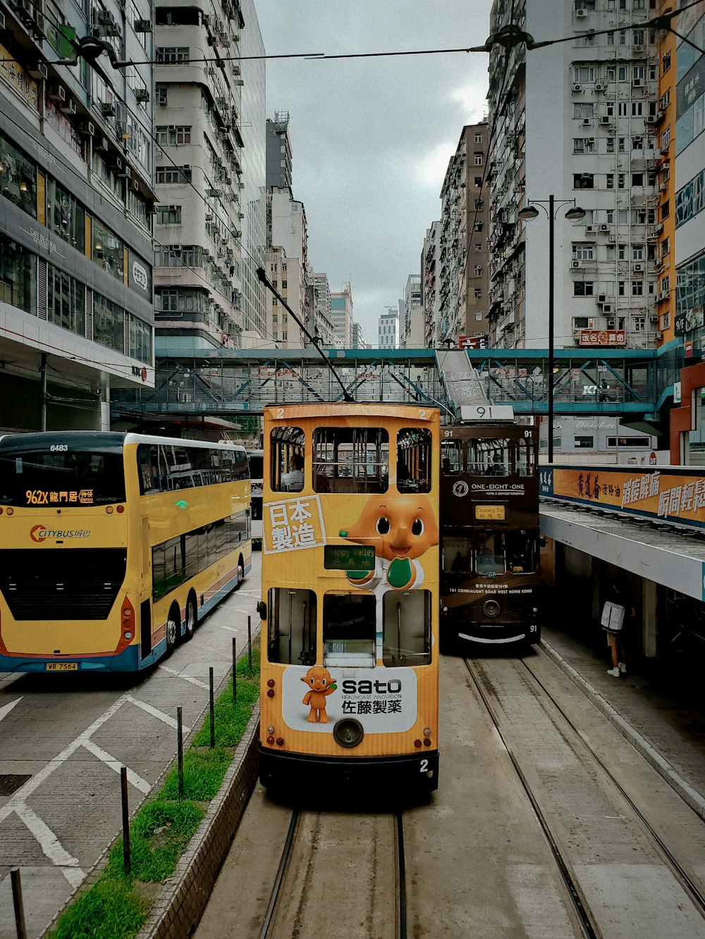 yellow and white tram on road during daytime