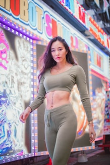 woman in gray long sleeve crop top and gray pants