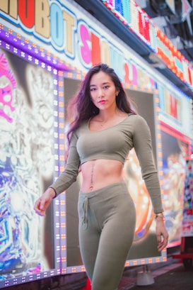woman in gray long sleeve crop top and gray pants