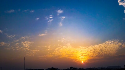 A vibrant sunset over a city skyline, symbolizing creativity and inspiration.