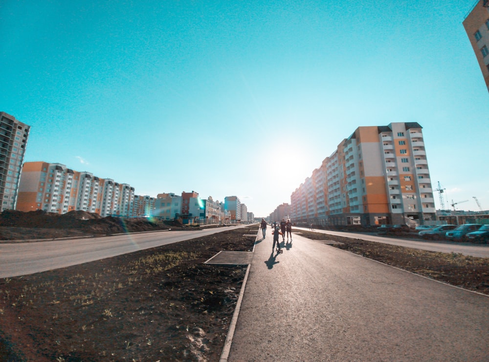 man in black jacket riding bicycle on road during daytime