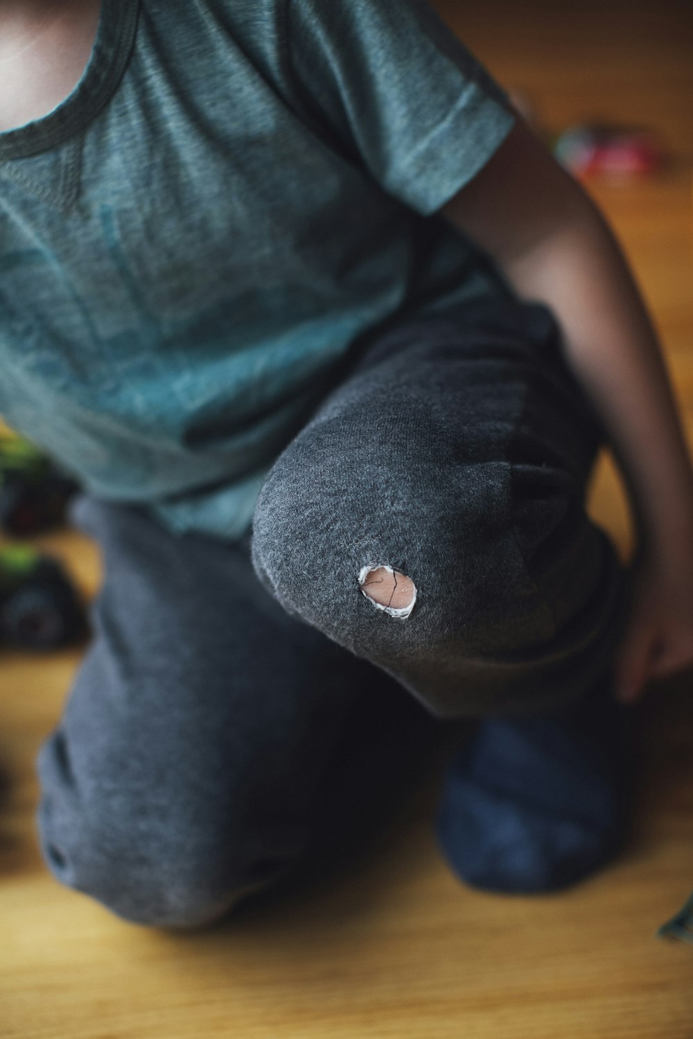 person in black shirt and blue denim jeans