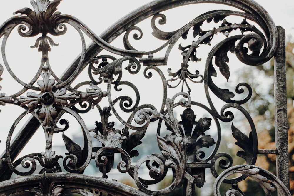 black metal fence with white snow