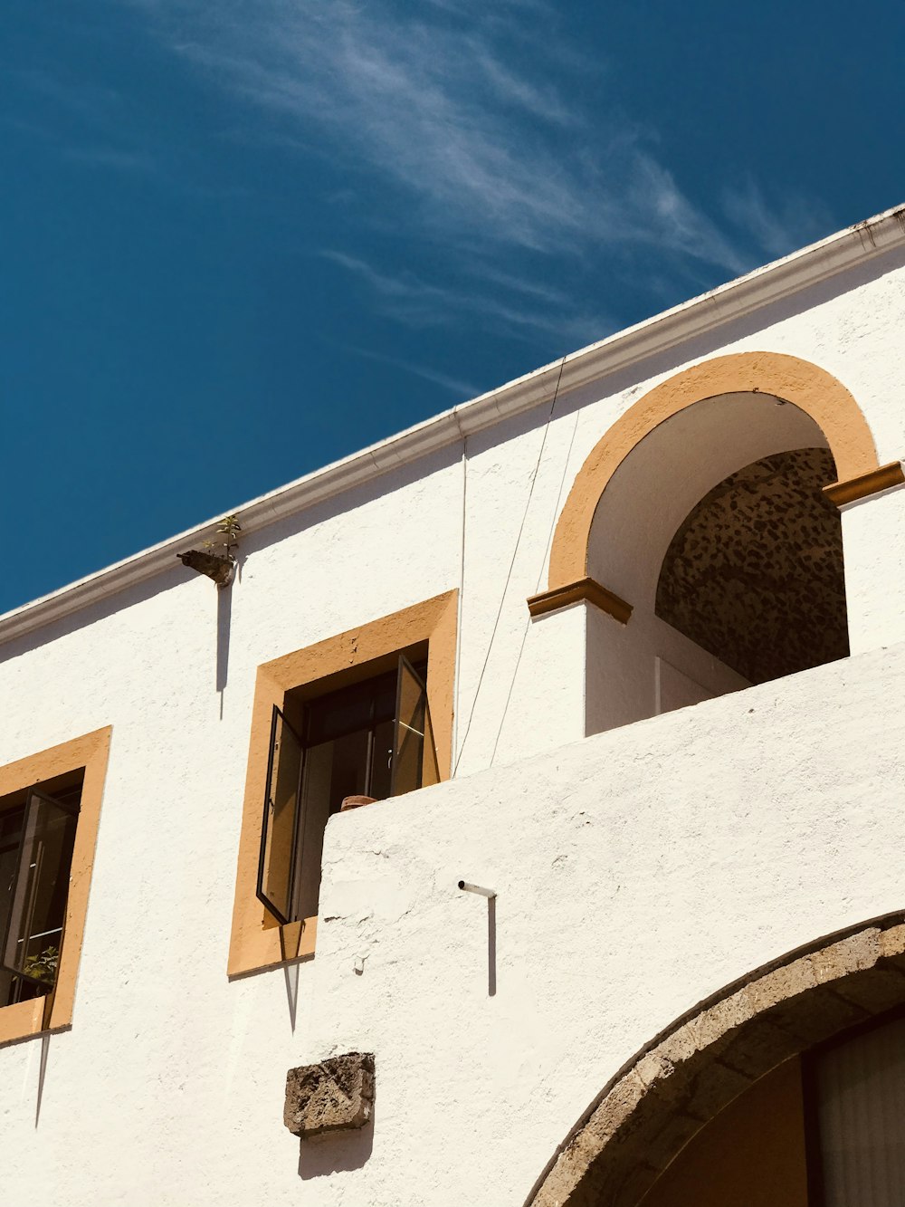 white concrete building under blue sky during daytime