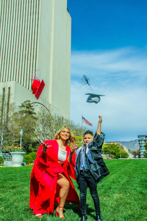 woman in black jacket holding red umbrella